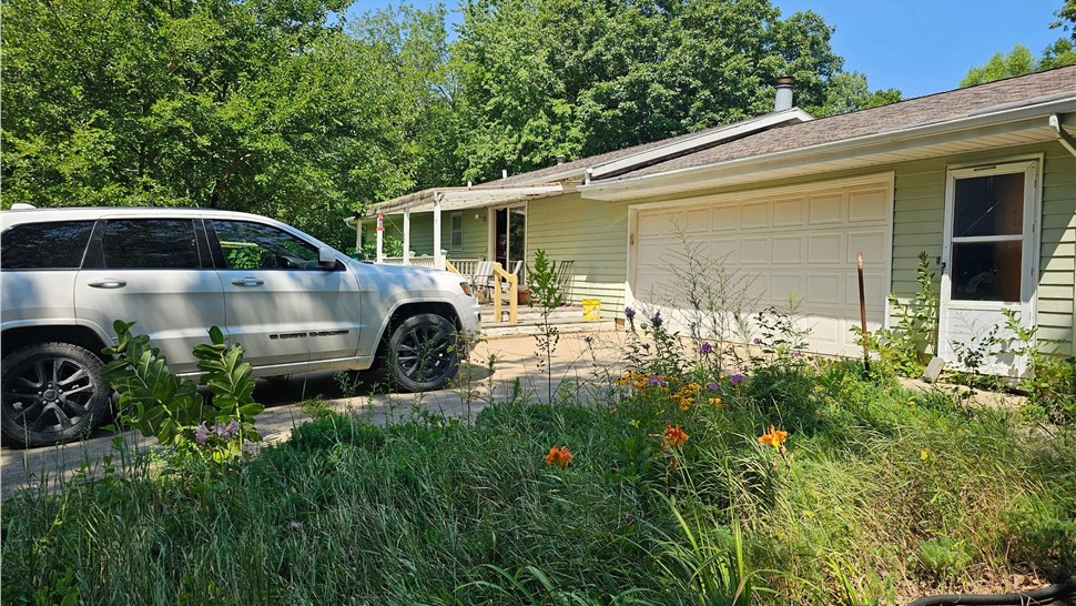 Seamless Gutters, Sunrooms Project in Ogden, IA by Midwest Construction