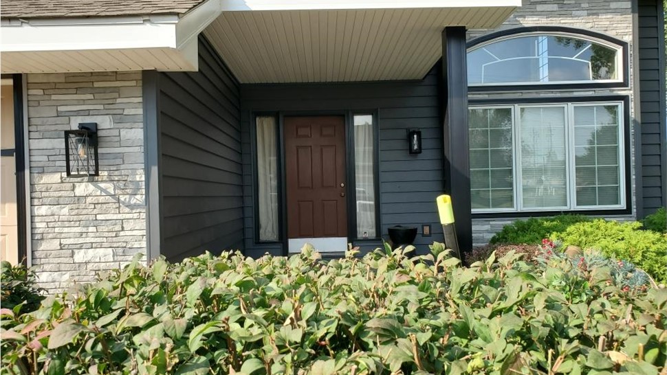 Seamless Gutters, Siding, Windows Project in Johnston, IA by Midwest Construction