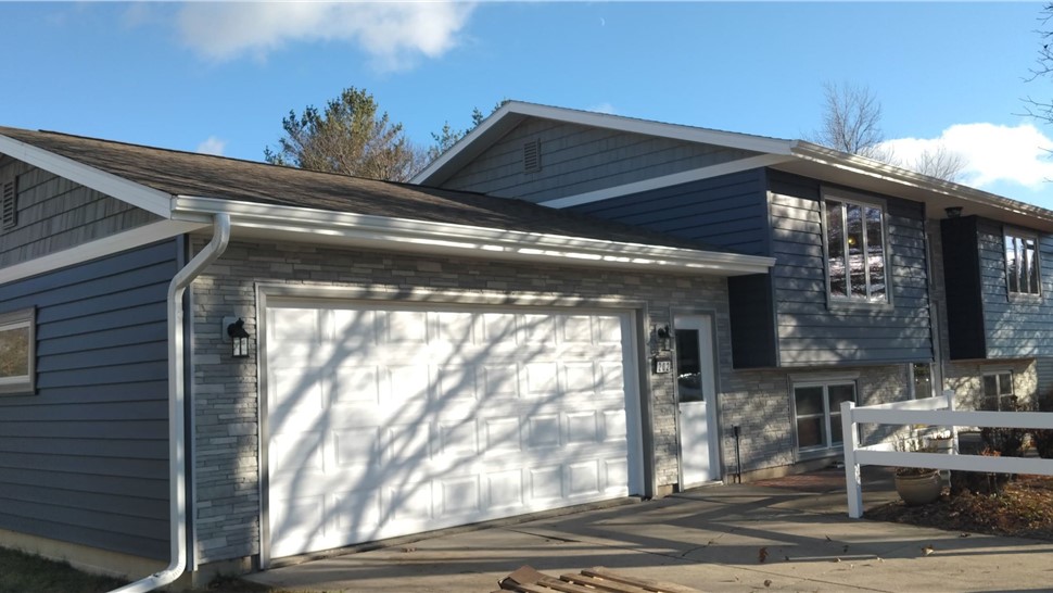 Patio Doors, Seamless Gutters, Siding, Windows Project in Roland, IA by Midwest Construction