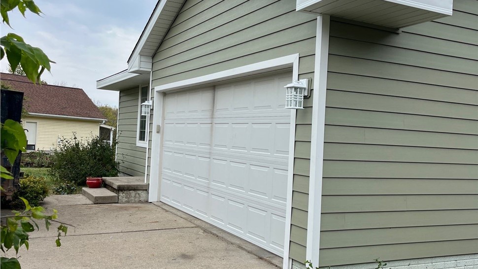 Seamless Gutters, Siding Project in Carlisle, IA by Midwest Construction
