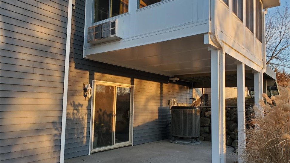 Decks, Doors, Roofing, Seamless Gutters, Siding, Sunrooms, Windows Project in Osceola, IA by Midwest Construction