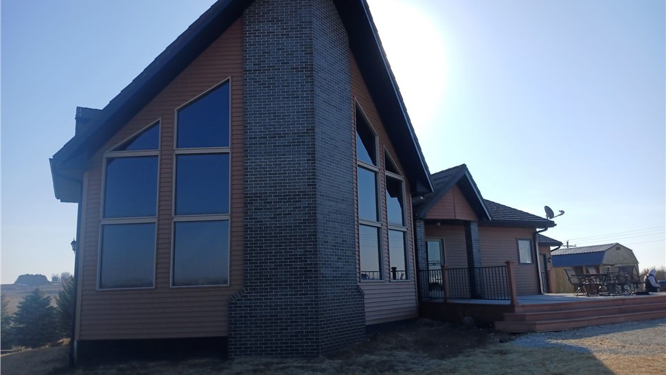 Seamless Gutters, Siding Project in Harlan, IA by Midwest Construction