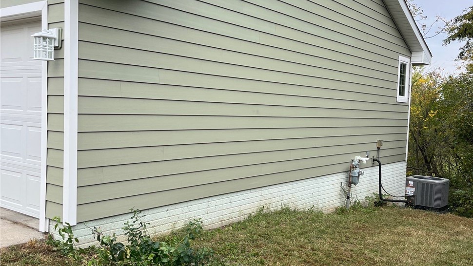 Seamless Gutters, Siding Project in Carlisle, IA by Midwest Construction