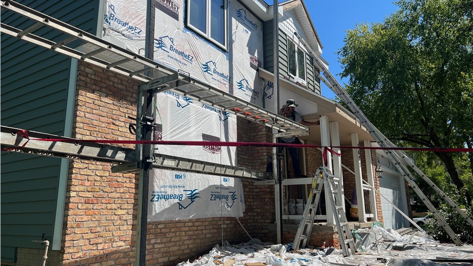 Roofing, Seamless Gutters, Siding Project in West Des Moines, IA by Midwest Construction