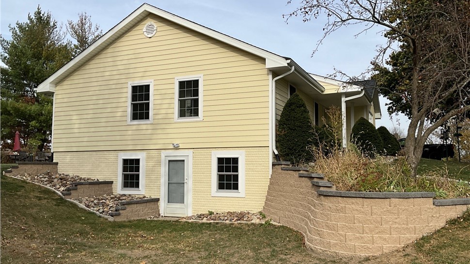 Decks, Seamless Gutters, Siding Project in Norwalk, IA by Midwest Construction