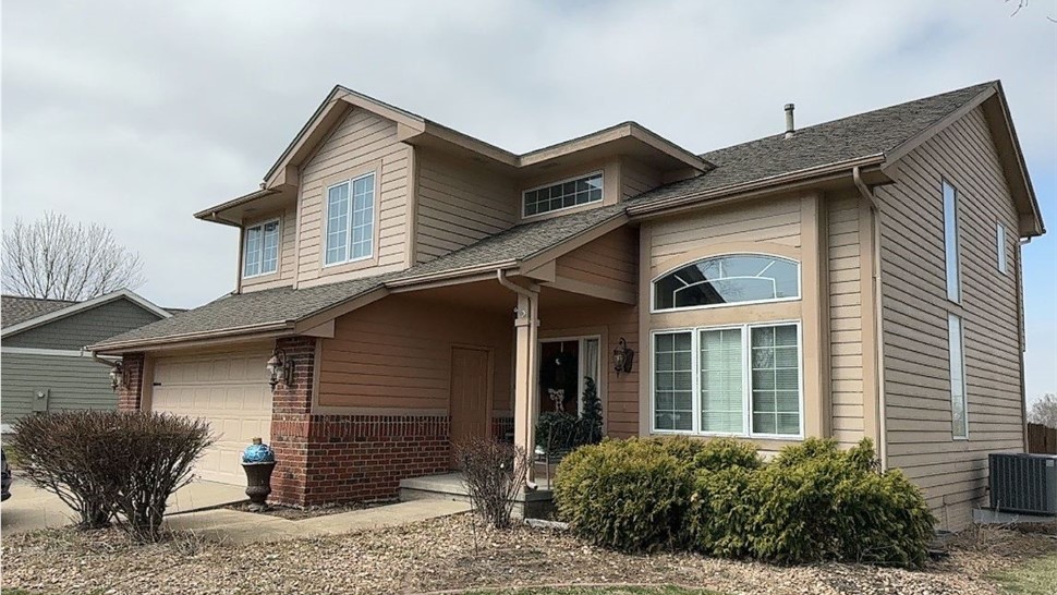 Seamless Gutters, Siding, Windows Project in Johnston, IA by Midwest Construction