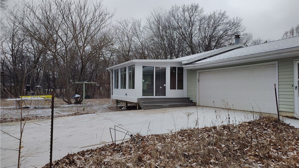 Seamless Gutters, Sunrooms Project in Ogden, IA by Midwest Construction