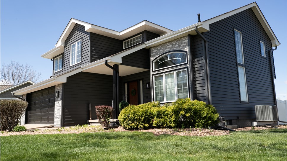 Seamless Gutters, Siding, Windows Project in Johnston, IA by Midwest Construction