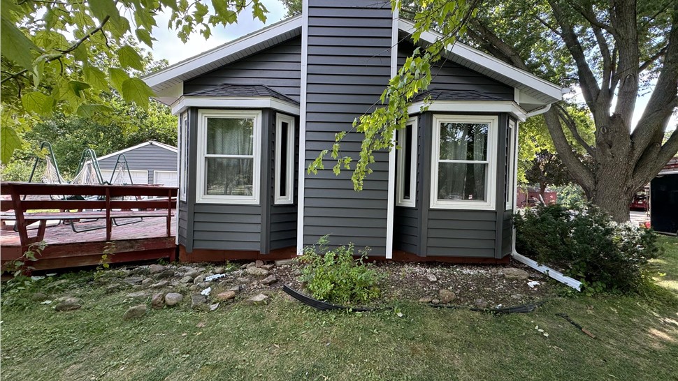 Seamless Gutters, Siding Project in Mason City, IA by Midwest Construction