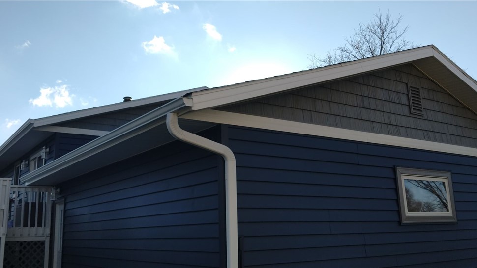 Patio Doors, Seamless Gutters, Siding, Windows Project in Roland, IA by Midwest Construction
