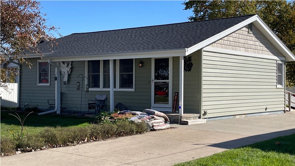 Seamless Gutters, Siding Project in Huxley, IA by Midwest Construction