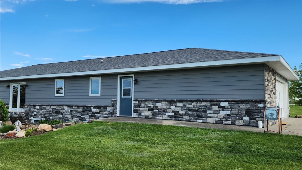 Manufactured Stone Siding, Siding, Windows Project in Osceola, IA by Midwest Construction