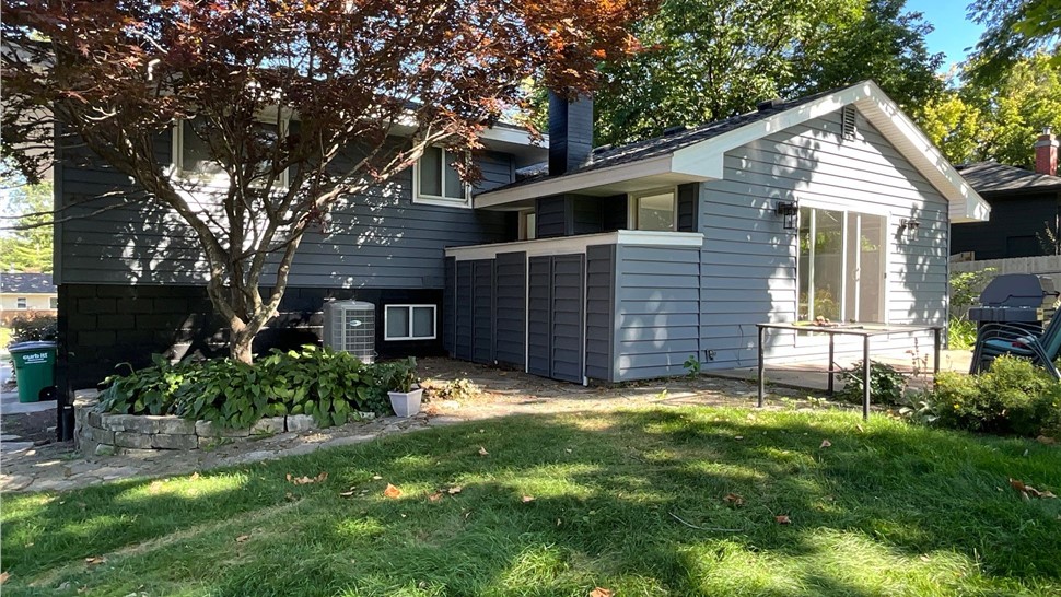 Seamless Gutters, Siding Project in West Des Moines, IA by Midwest Construction