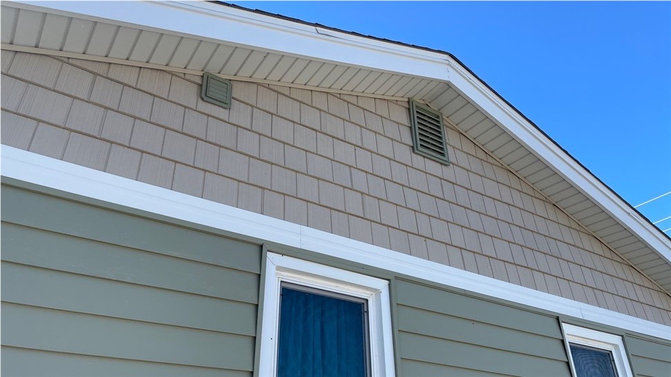 Seamless Gutters, Siding Project in Huxley, IA by Midwest Construction
