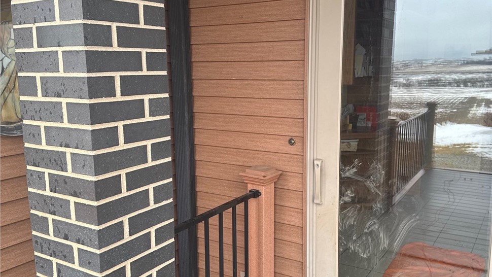 Seamless Gutters, Siding Project in Harlan, IA by Midwest Construction