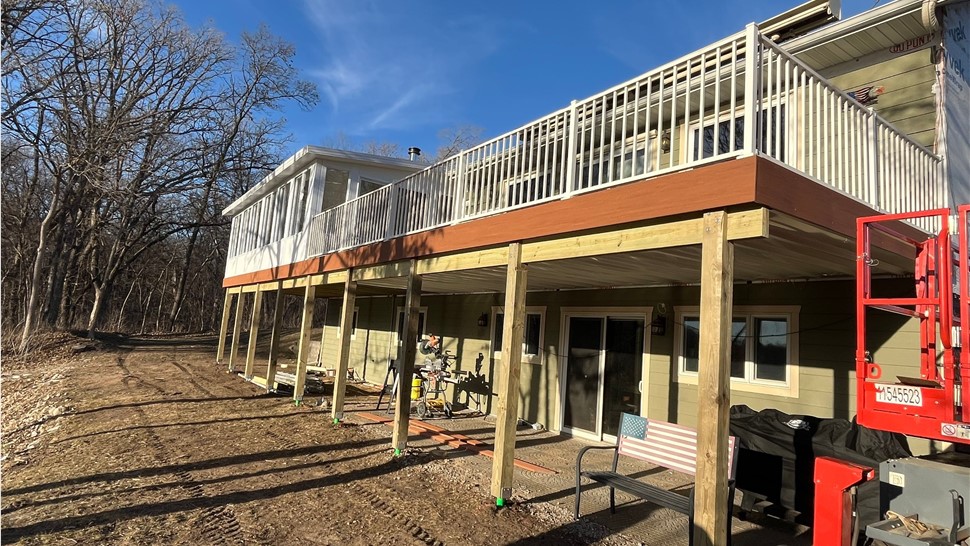 Decks, Doors, Manufactured Stone Siding, Patio Doors, Seamless Gutters, Siding, Sunrooms, Windows Project in Floyd, IA by Midwest Construction