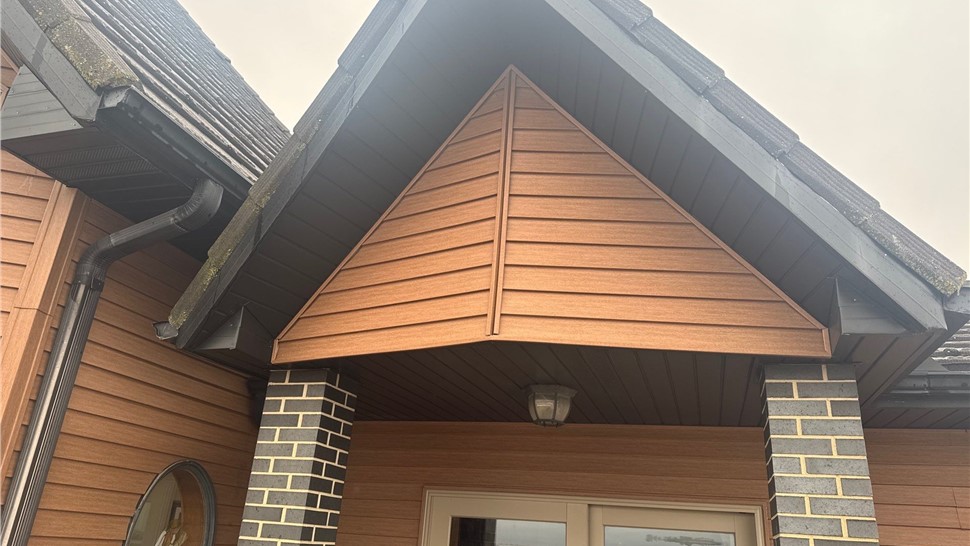 Seamless Gutters, Siding Project in Harlan, IA by Midwest Construction