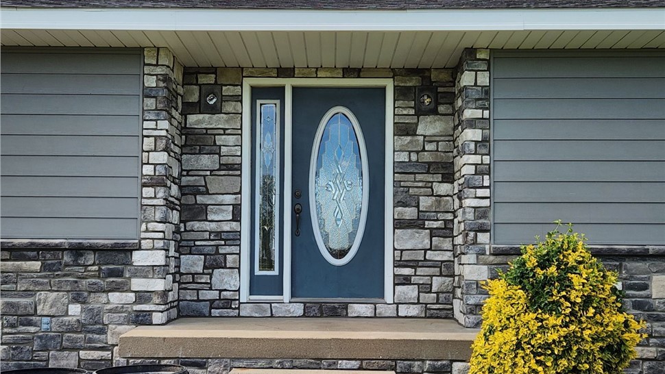 Manufactured Stone Siding, Siding, Windows Project in Osceola, IA by Midwest Construction