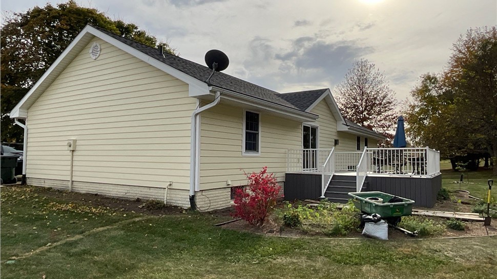 Decks, Seamless Gutters, Siding Project in Norwalk, IA by Midwest Construction