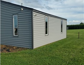 Seamless Gutters, Siding, Windows Project in Marshalltown, IA by Midwest Construction