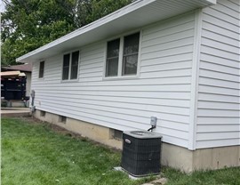 Decks, Seamless Gutters, Siding Project in Bondurant, IA by Midwest Construction