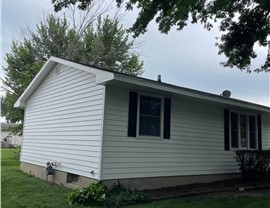 Decks, Seamless Gutters, Siding Project in Bondurant, IA by Midwest Construction