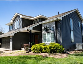 Seamless Gutters, Siding, Windows Project in Johnston, IA by Midwest Construction