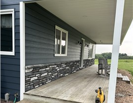 Manufactured Stone Siding Project in Eddyville, IA by Midwest Construction