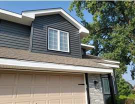 Seamless Gutters, Siding, Windows Project in Johnston, IA by Midwest Construction