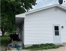 Decks, Seamless Gutters, Siding Project in Bondurant, IA by Midwest Construction