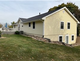 Decks, Seamless Gutters, Siding Project in Norwalk, IA by Midwest Construction