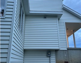 Seamless Gutters, Siding Project in Norwalk, IA by Midwest Construction