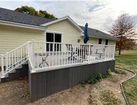 Decks, Seamless Gutters, Siding Project in Norwalk, IA by Midwest Construction