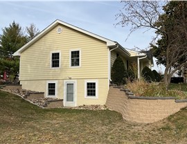 Decks, Seamless Gutters, Siding Project in Norwalk, IA by Midwest Construction