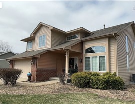 Seamless Gutters, Siding, Windows Project in Johnston, IA by Midwest Construction