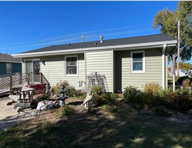 Seamless Gutters, Siding Project in Huxley, IA by Midwest Construction