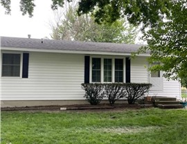 Decks, Seamless Gutters, Siding Project in Bondurant, IA by Midwest Construction