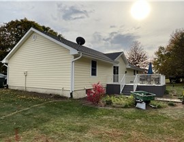 Decks, Seamless Gutters, Siding Project in Norwalk, IA by Midwest Construction