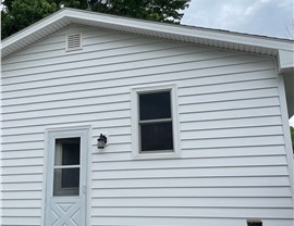 Decks, Seamless Gutters, Siding Project in Bondurant, IA by Midwest Construction