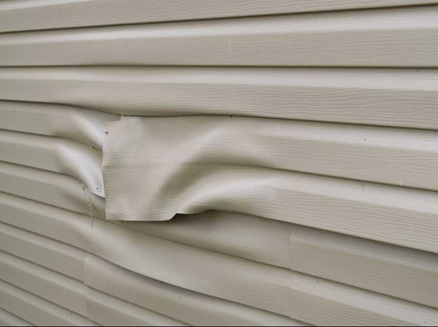 Warped, melting vinyl siding.