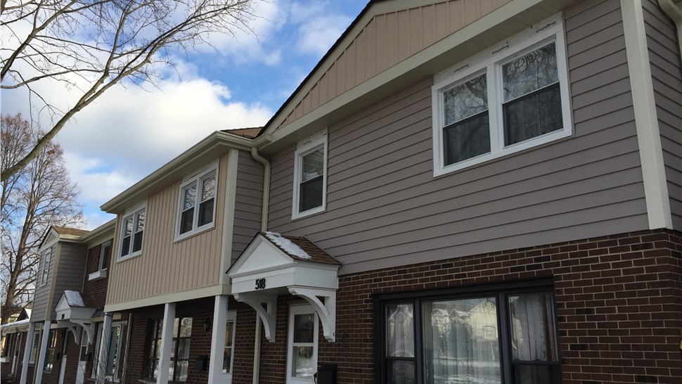 Vinyl Siding Repair and Gutter Installation Project in Wood Dale, IL by Pro Home 1