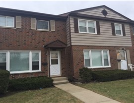 Vinyl Siding Repair and Gutter Installation Project in Wood Dale, IL by Pro Home 1