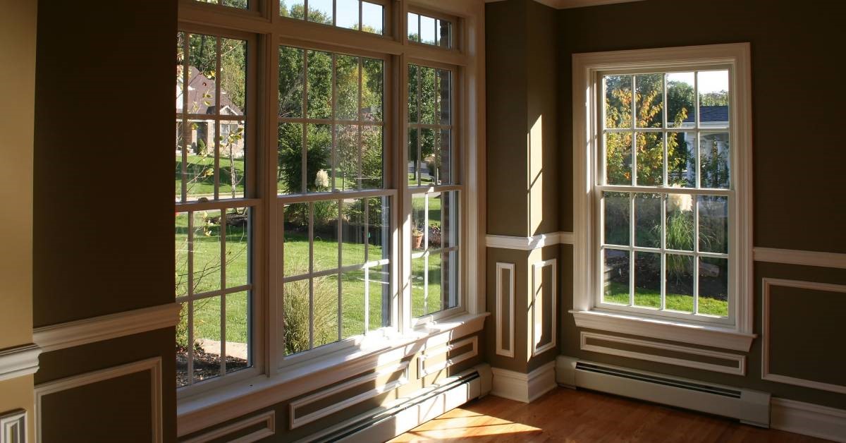 A sunny corner in a recently remodeled home, boasting newly installed windows and hardwood floors.