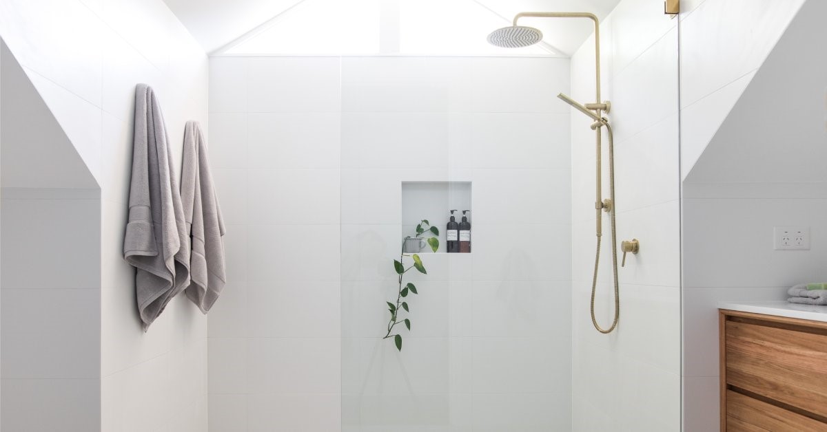 A modern roll-in shower featuring a zero-threshold entry.