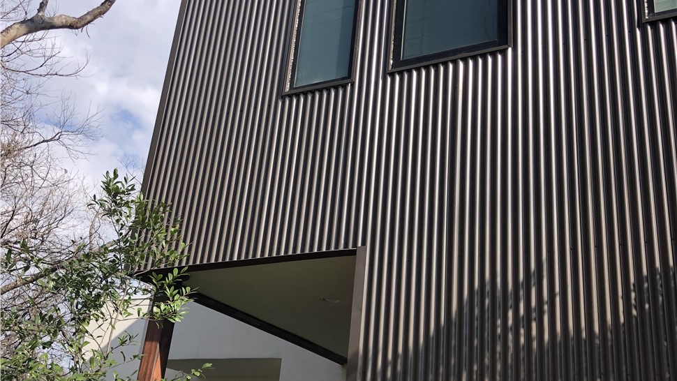 Modern corrugated metal wall siding detail on Austin TX home