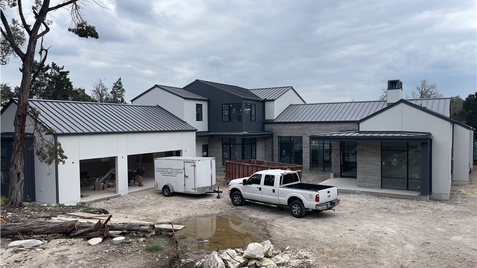 New construction standing seam metal roof in Westlake TX with Sheffield Metals charcoal gray panels