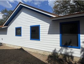 Hardie 8.25 Cedarmill lap siding with Andersen 100 Series black windows in Austin TX