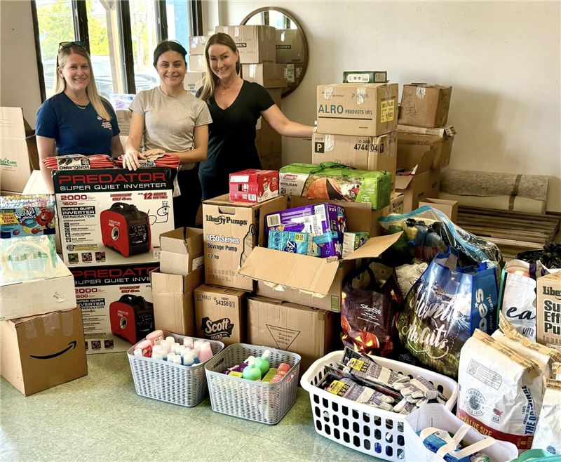Young girl with Sea Cure sign at sports field