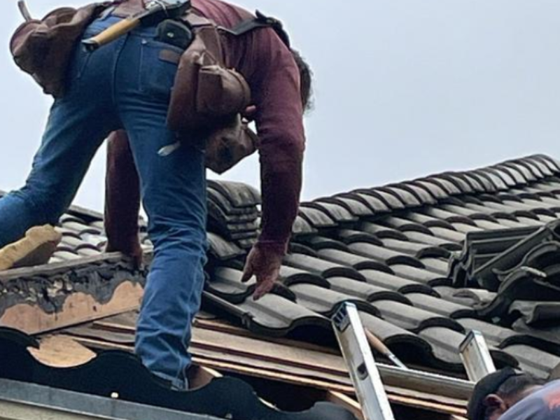 An image showing Spartan Roofing &amp; Siding conducting a roof repair: San Antonio, TX.
