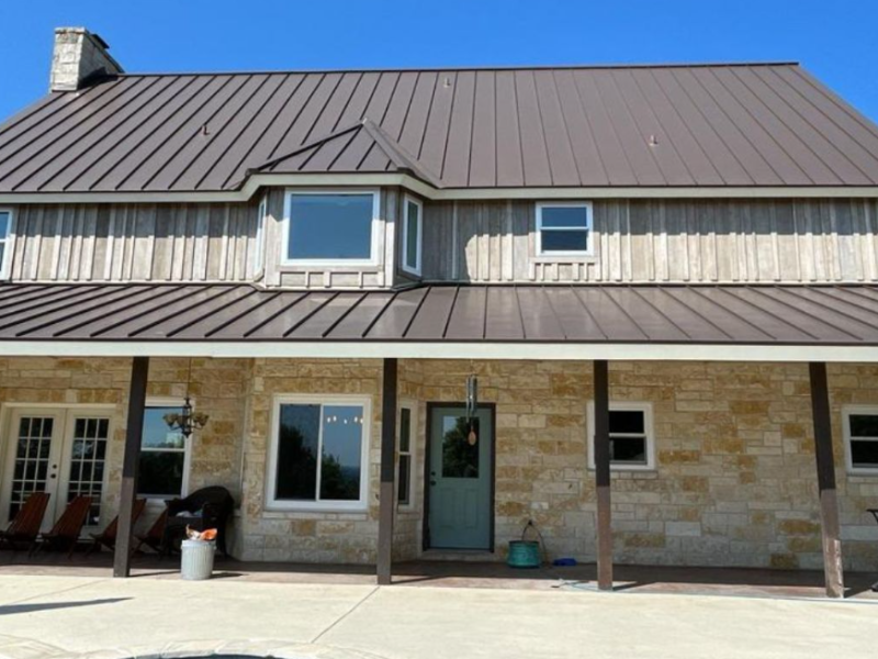 An image showing a new standing steam metal roof on a home in San Antonio: by Spartan Roofing &amp; Siding. 
